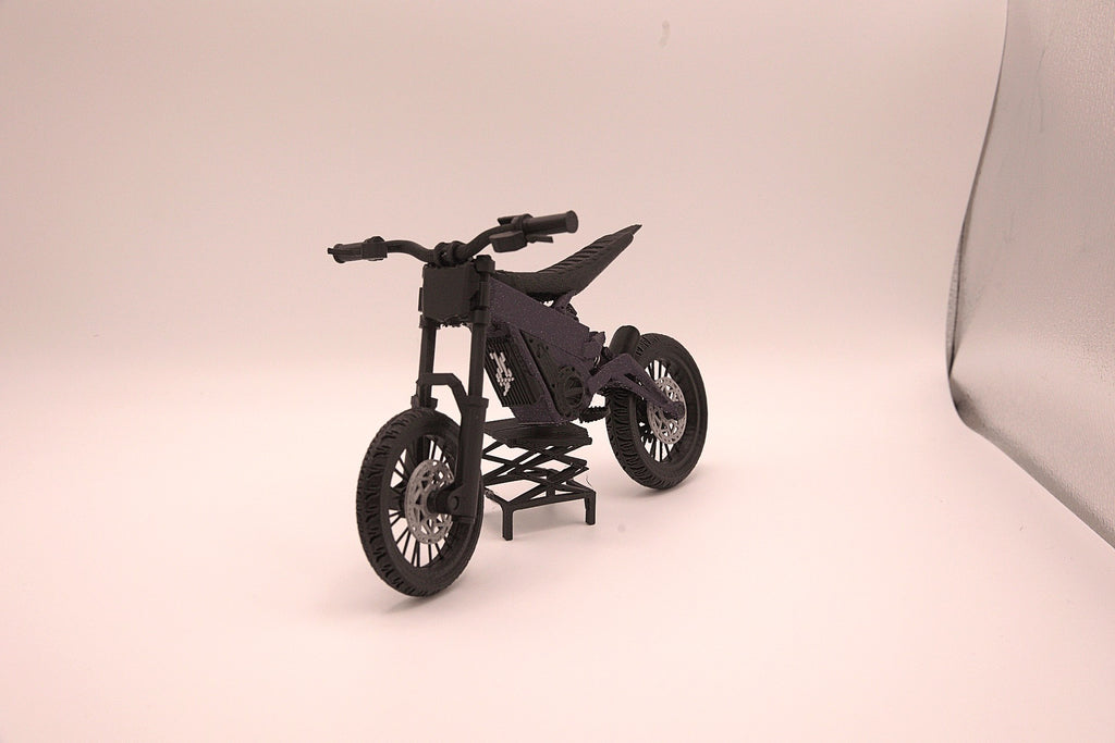 Mini Talaria X3 3D printed miniature electric bike model in black, side profile on its display stand