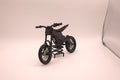Mini Talaria X3 3D printed miniature electric bike model in black, side profile on its display stand