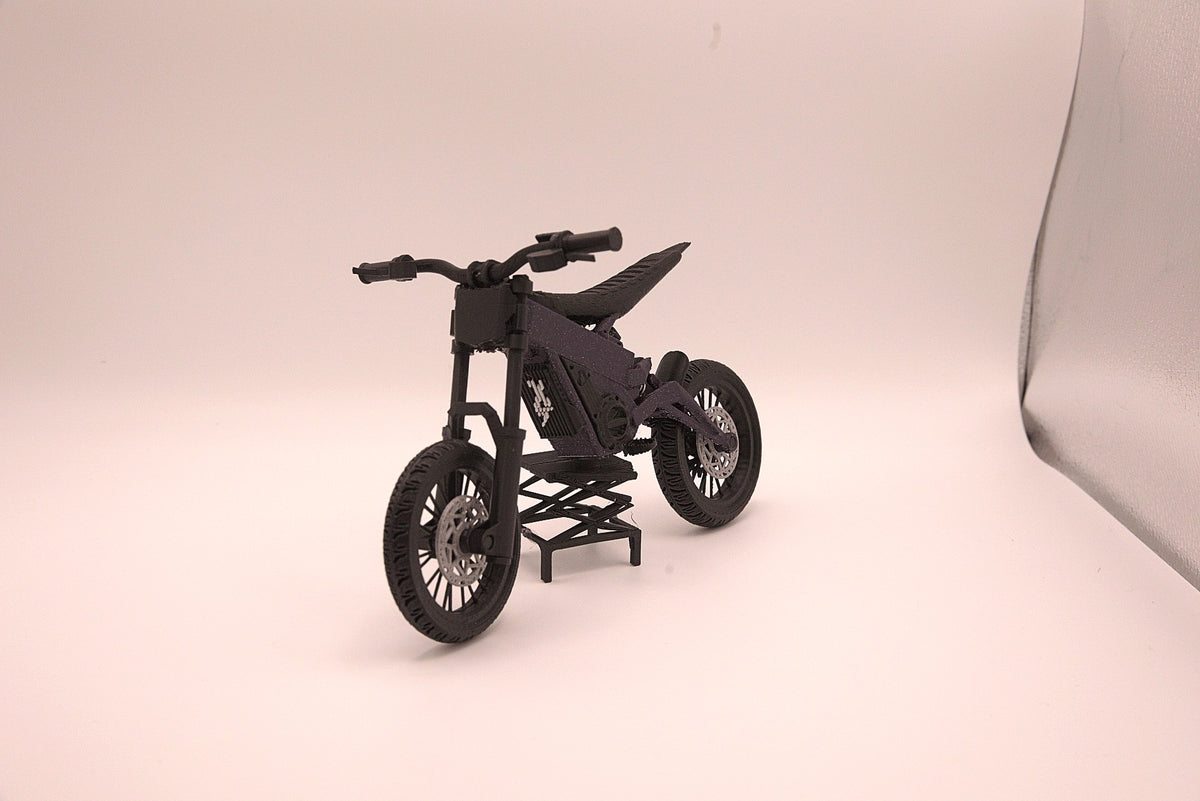 Mini Talaria X3 3D printed miniature electric bike model in black, side profile on its display stand