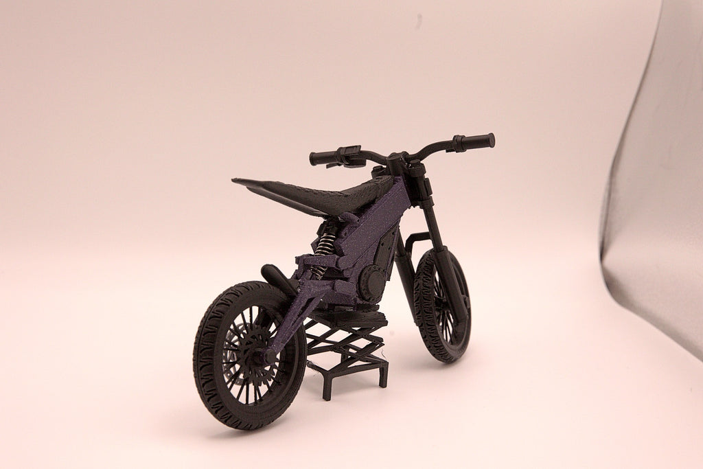 Mini Talaria X3 3D printed miniature electric bike model, front three-quarter view showing handlebars, suspension forks and knobby tires