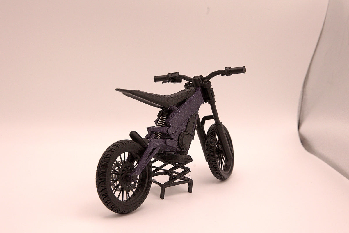 Mini Talaria X3 3D printed miniature electric bike model, front three-quarter view showing handlebars, suspension forks and knobby tires